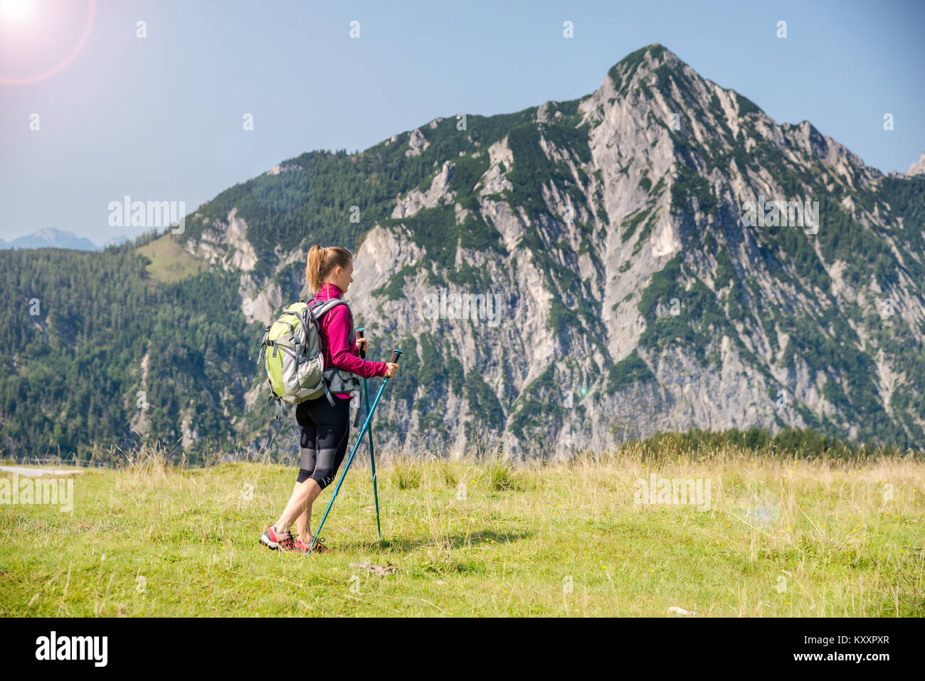 Young woman hiking in the mountains Stock Photo - Alamy