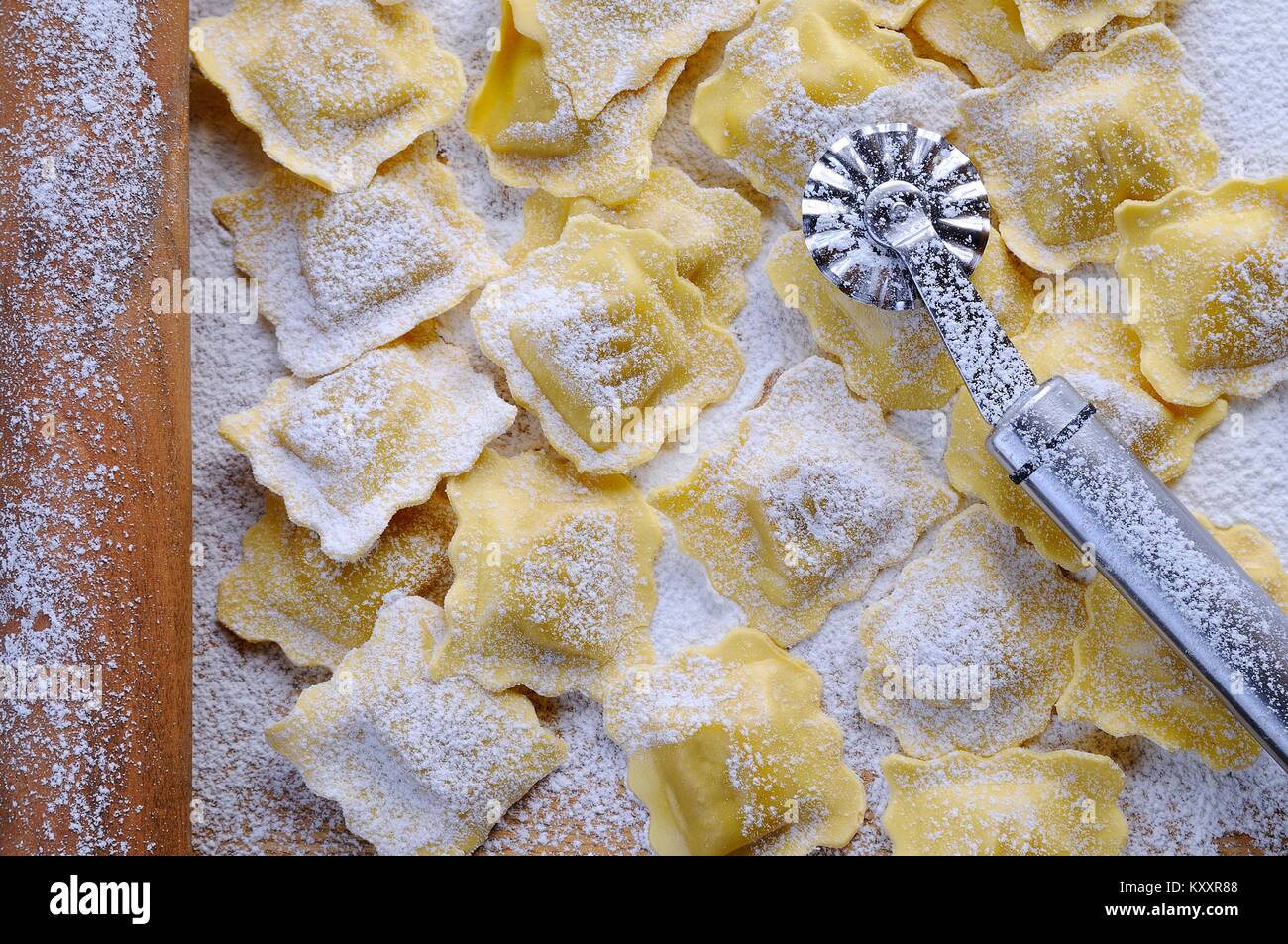 Preparing fresh ravioli at the kitchen table Stock Photo - Alamy