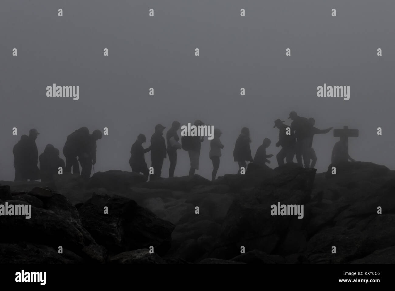 Bad fog & weather as hikers summit Mt. Washington in New Hampshire