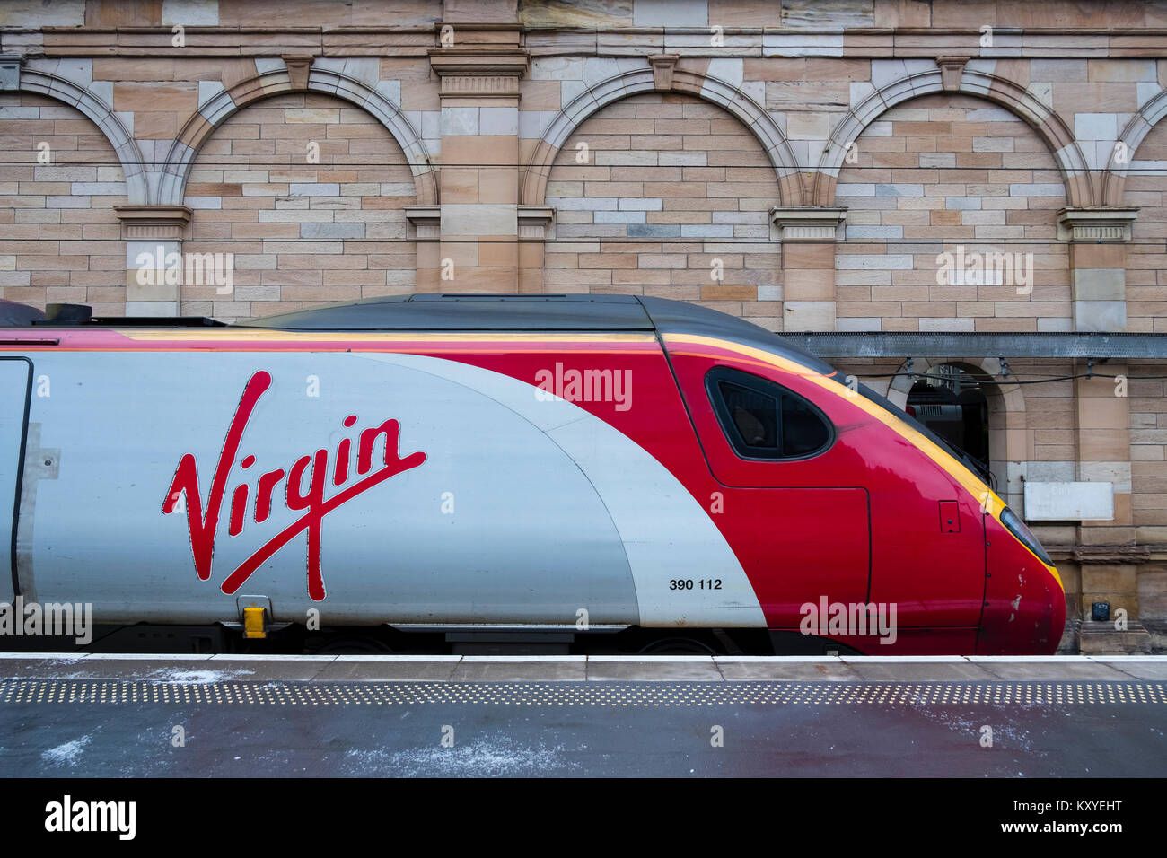 Virgin Trains Pendolino locomotive to London Euston  on West Coast Main line  at platform at Waverley Station in Edinburgh, Scotland, United Kingdom Stock Photo