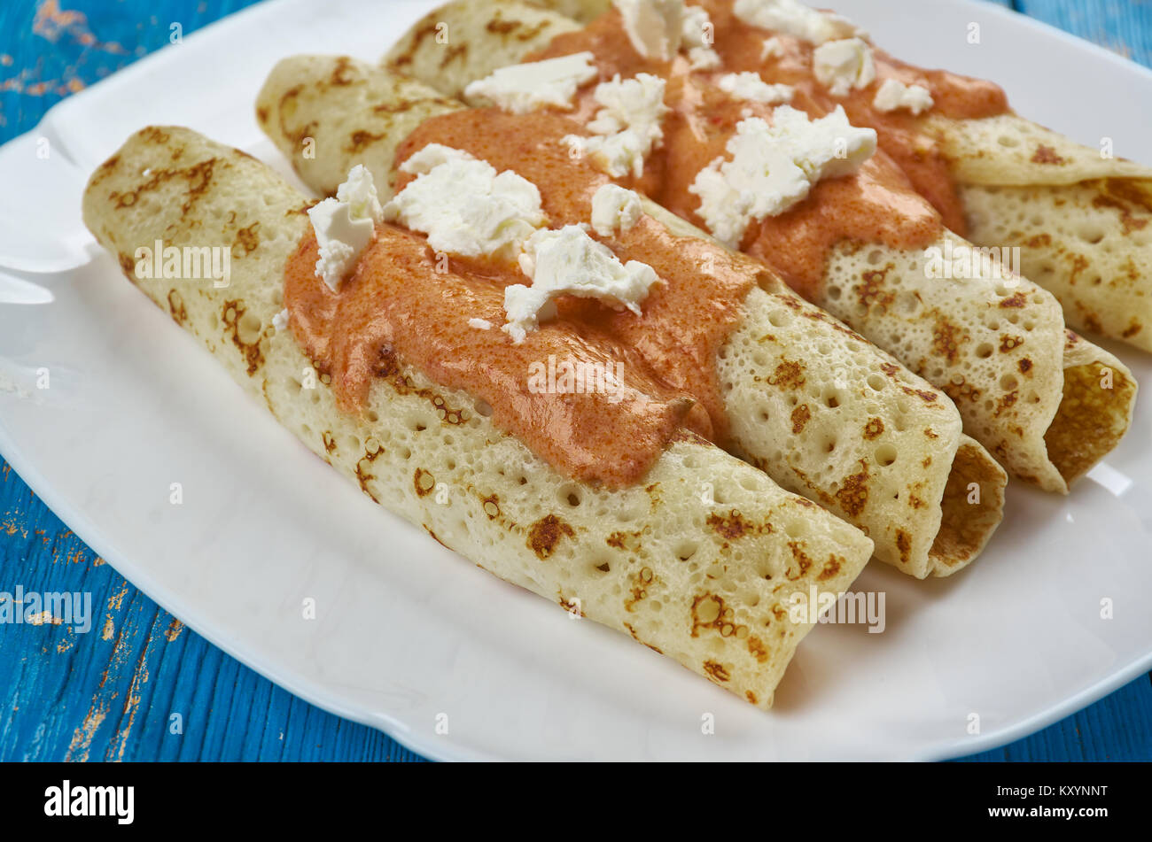 Entomatada typical Mexican dish made of a folded corn tortilla which