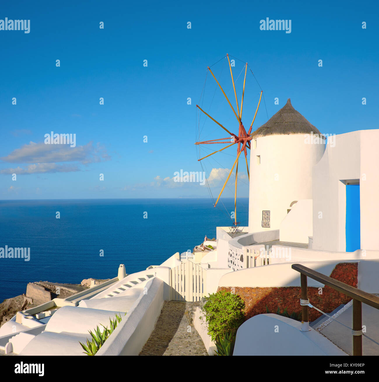 Beautiful Santorini in Greece - traditional windmill in Oia village on a sunny day. Panoramic image, square composition. Stock Photo