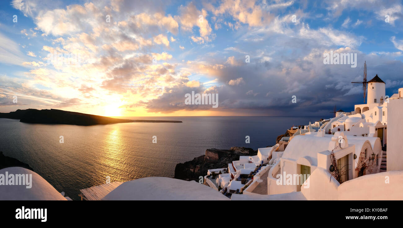 Glorious sunset in Oia village on Santorini island, Greece, panoramic image Stock Photo