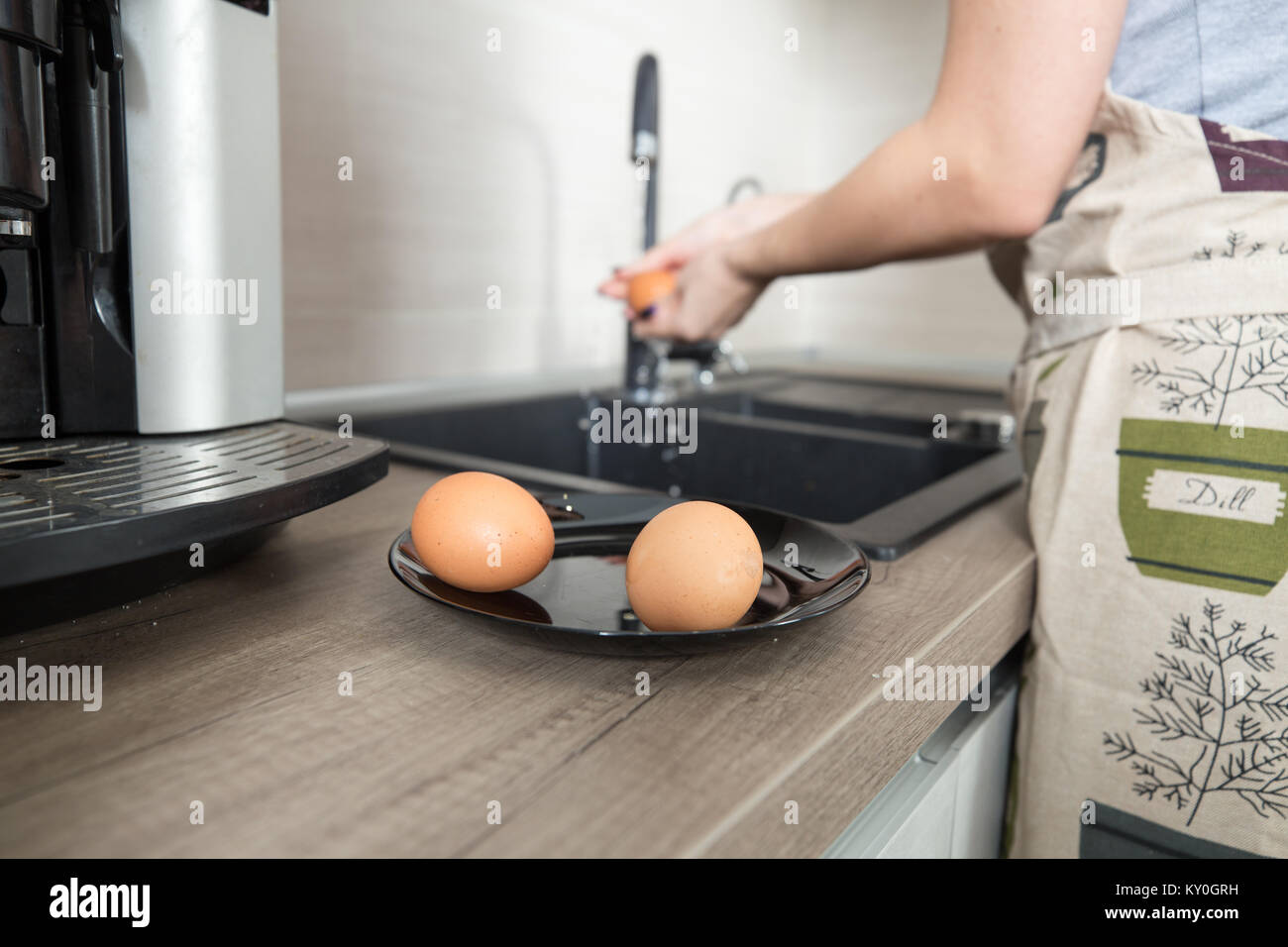 Eggs on plate at kitchen. Eggs for cooking cake. Stock Photo