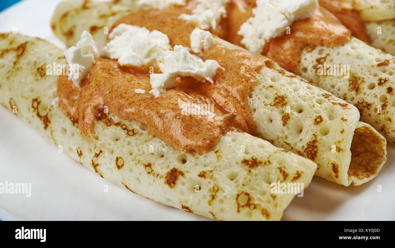 Entomatada typical Mexican dish made of a folded corn tortilla which