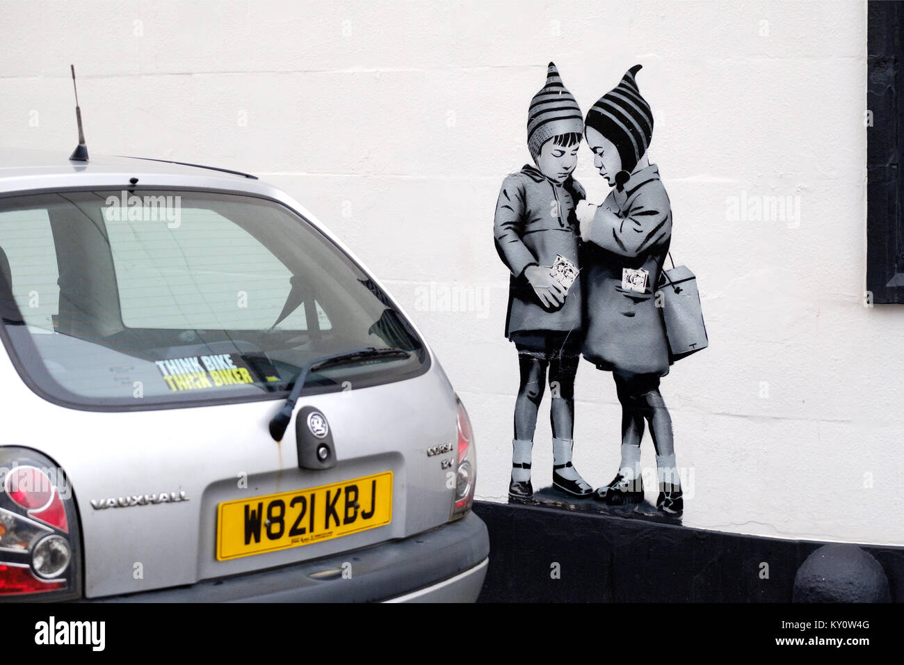A banksy inspired stenciled artwork called The Big Deal on the wall of a pub in Weston super Mare, UK. Created by renown local graffiti artist JPS. Stock Photo