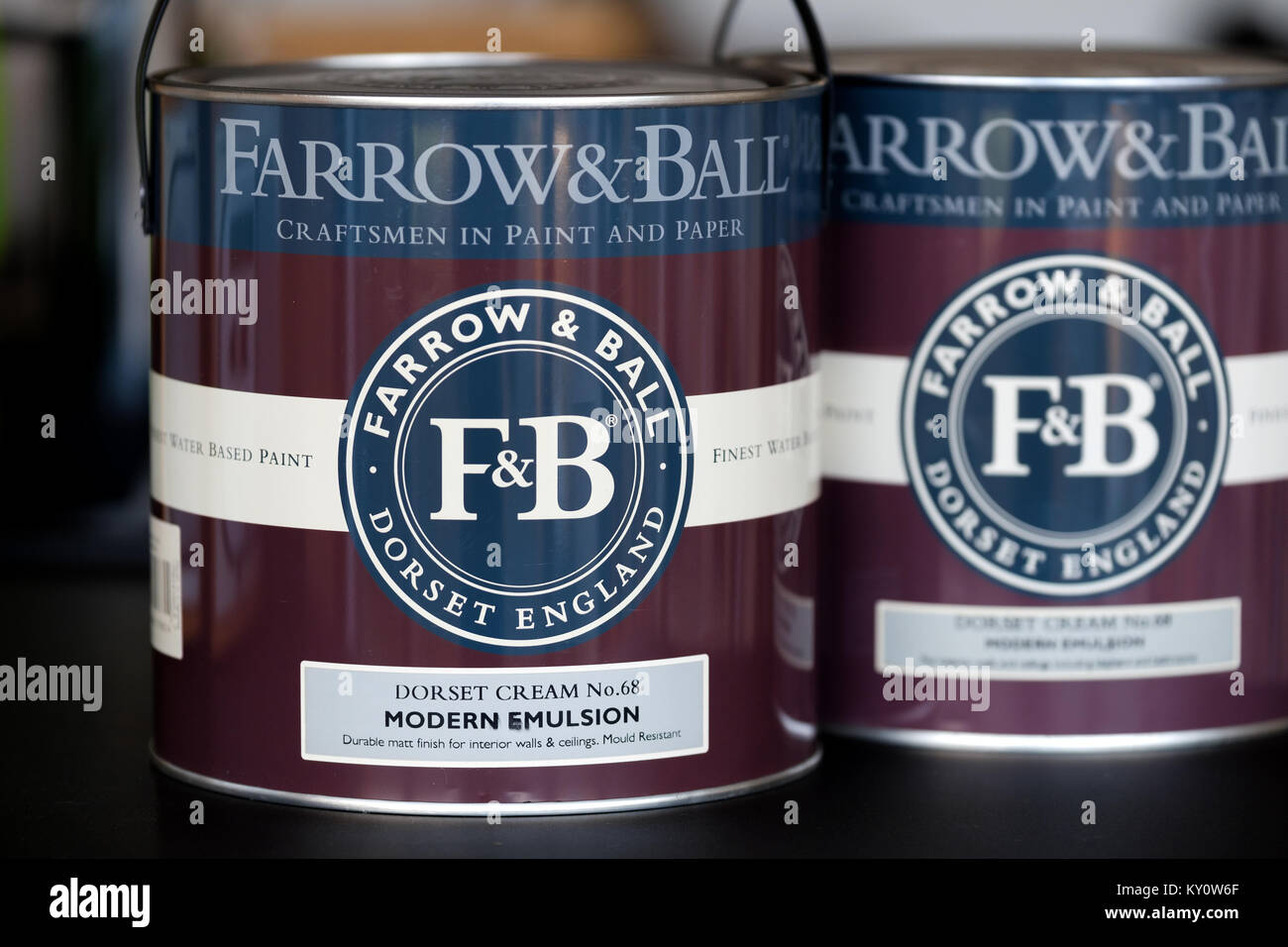 Two new unopened tins of Farrow and Ball paint. The tins clearly show the company banding and logo. A high end expensive, niche paint for the home Stock Photo