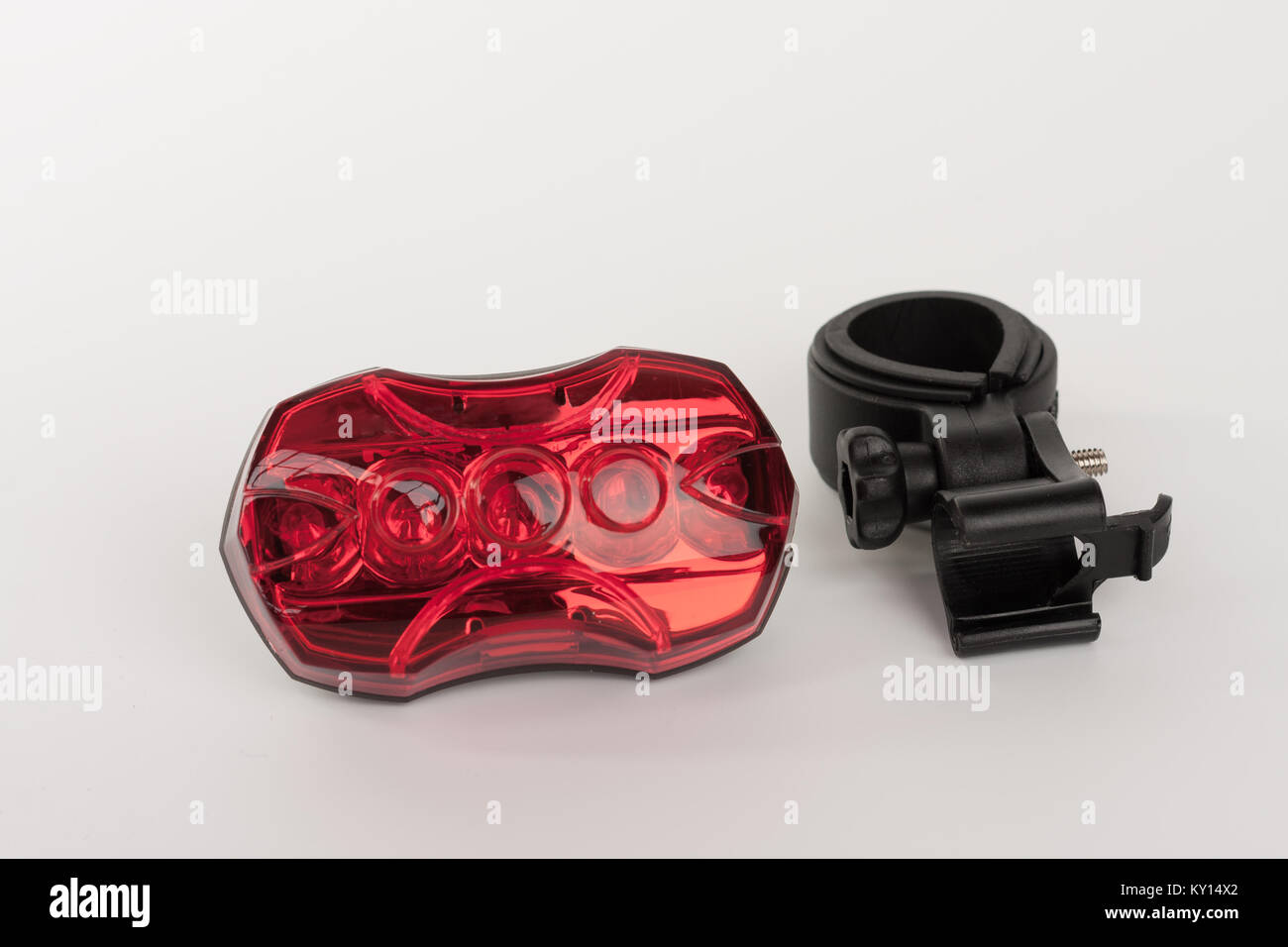 Red rear bicycle flashing light and holder of light , studio photo