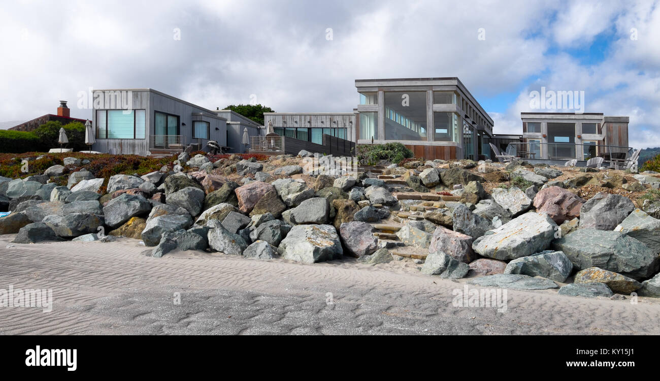 Stinson Beach, California oceanfront houses. Piled boulders and sandy