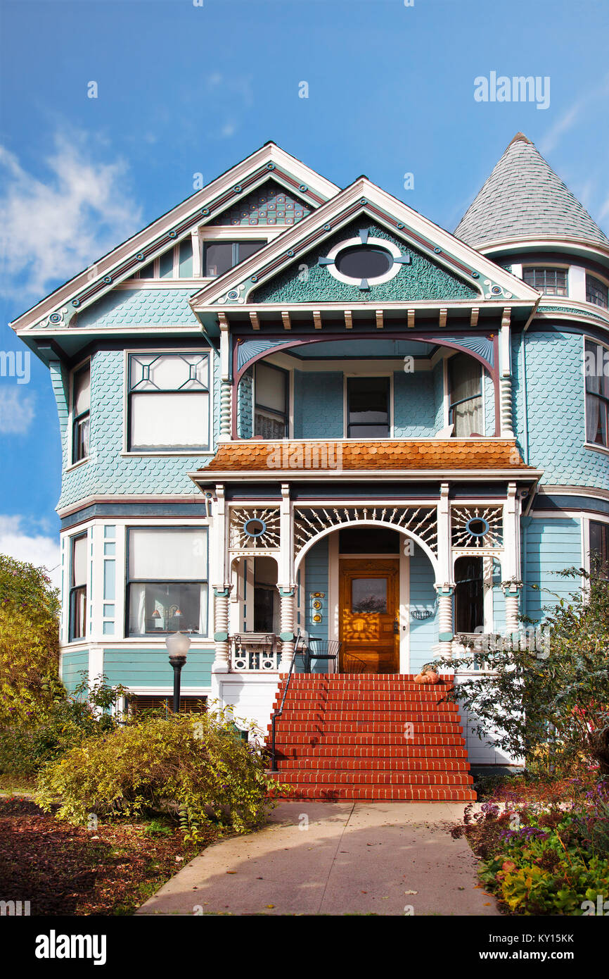Victorian house in light blue with white gingerbread trim. Queen Anne style. Location: San Francisco Bay Area, Alameda Stock Photo