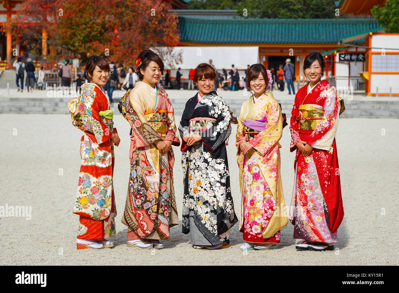 JAPAN - NOVEMBER 22 2015: Beautiful Japanese ladies in traditional kimono dress at Heian-jingu shrine, kyoto Stock Photo