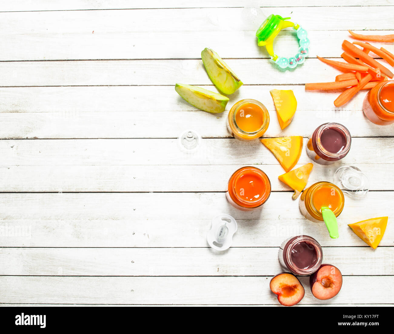 Baby food. Various baby purees from fresh vegetables and fruits. On a ...