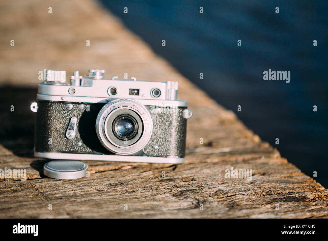 35mm Vintage Old Retro SmallFormat Rangefinder Camera On Old Wooden