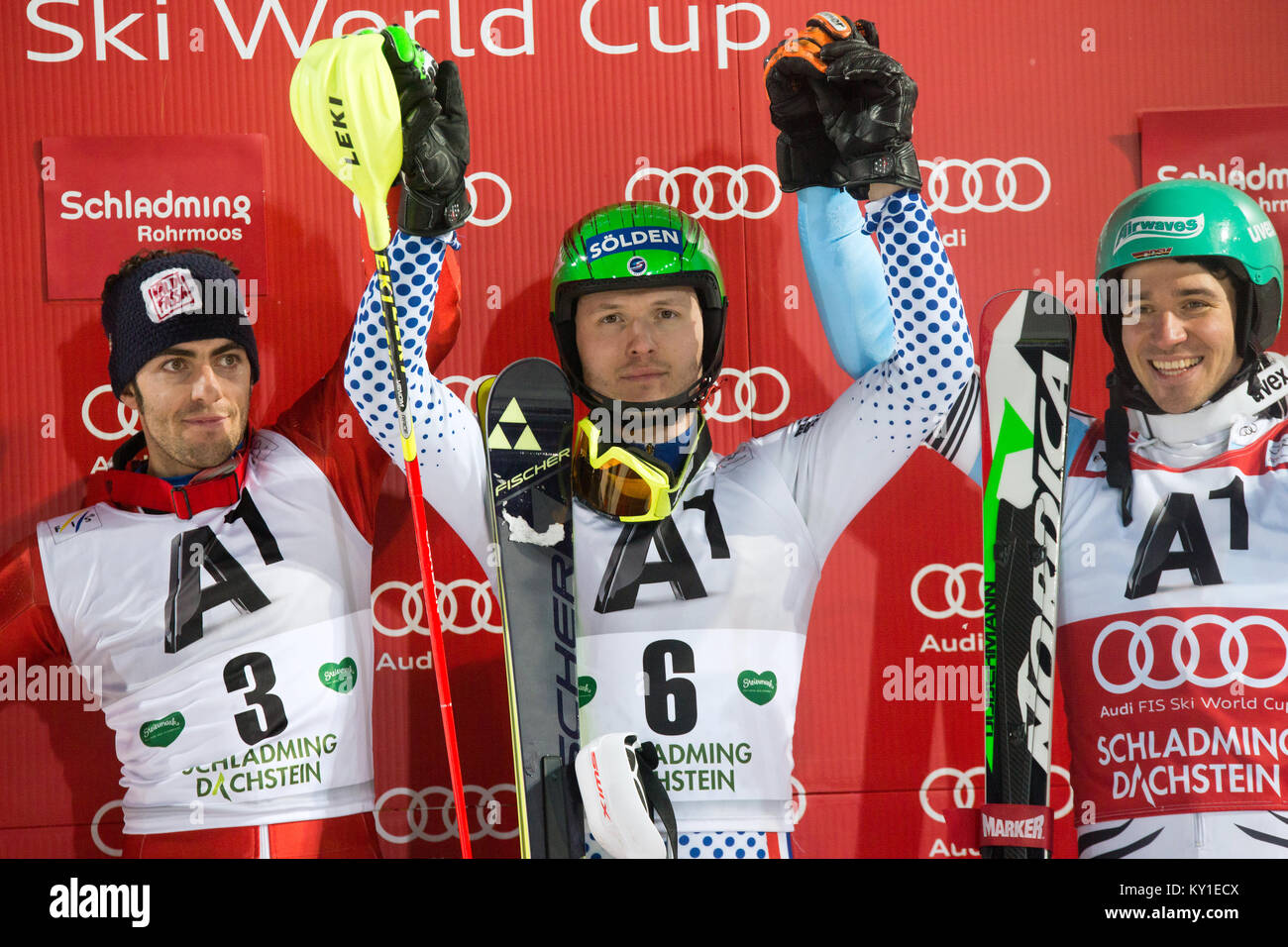 Russia’s Alexander Khoroshilov (C) wins his first World Cup win at tonight’s slalom race of the Men’s AUDI FIS World Cup in Schladming ahead of Stefano Gross (L) of Italy and Felix Neureuther (R) from Germany. Photo credit: Christoph Oberschneider. Stock Photo