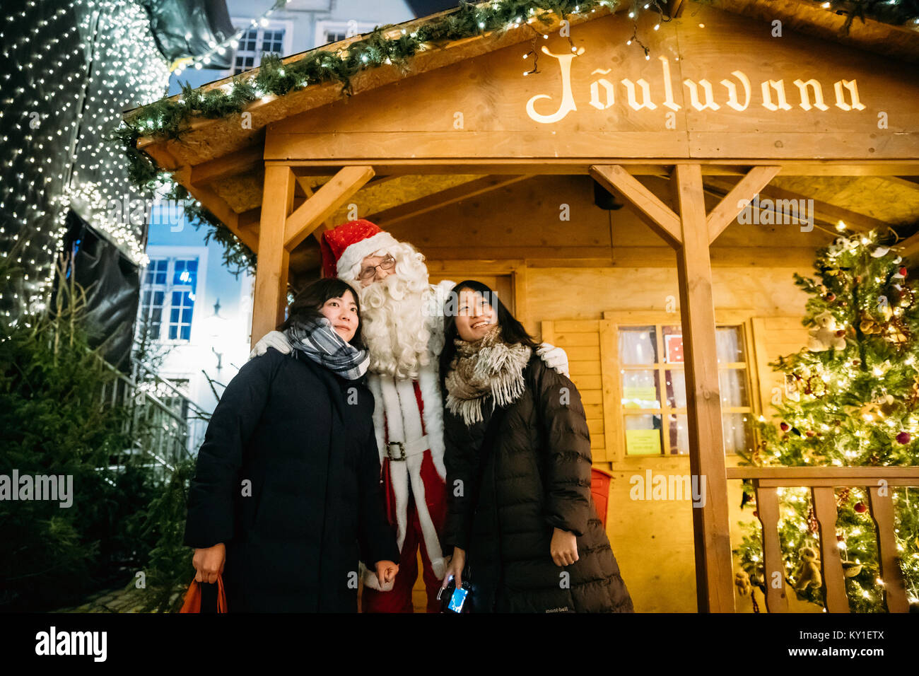 Tallinn, Estonia - December 21, 2017: Chinese Tourists Photographed With Santa Claus At His Residence. Stock Photo