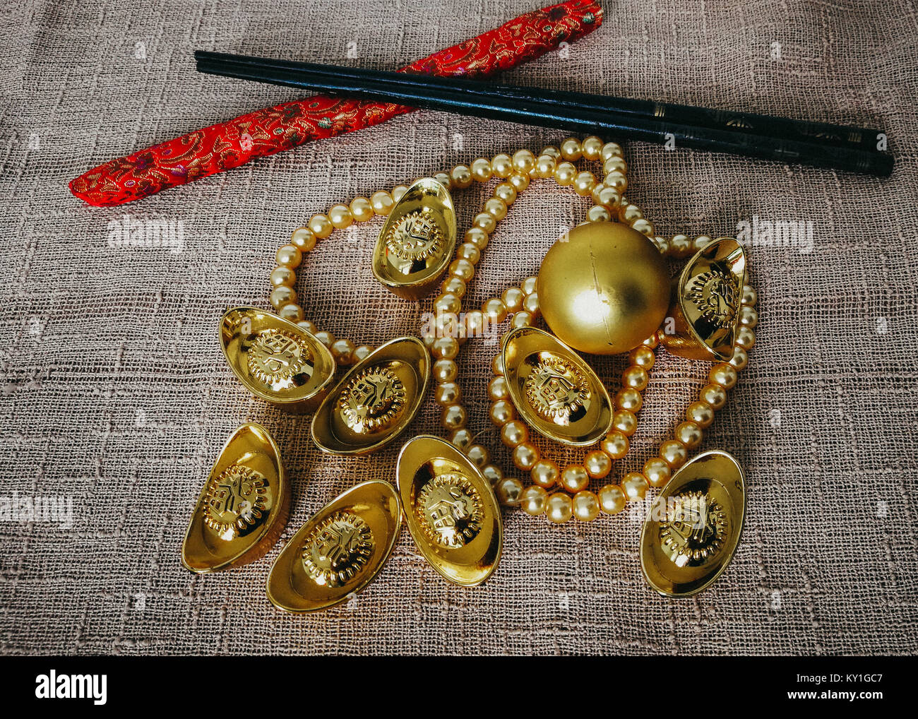 Chinese New Year celebration with decoration, gold ingots and golden pearls represent luxury and prosperity Stock Photo