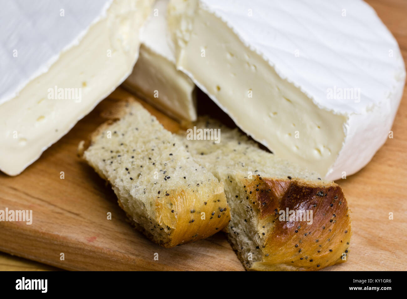 Fresh pastry with poppy seeds excellently paired with Camembert cheese brie . Stock Photo