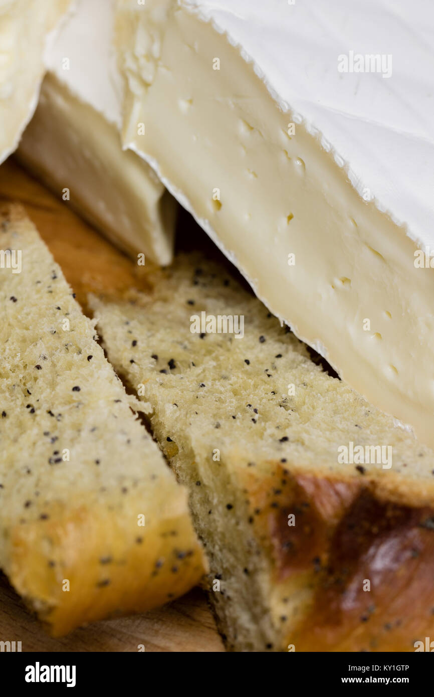 Fresh pastry with poppy seeds excellently paired with Camembert cheese brie . Stock Photo