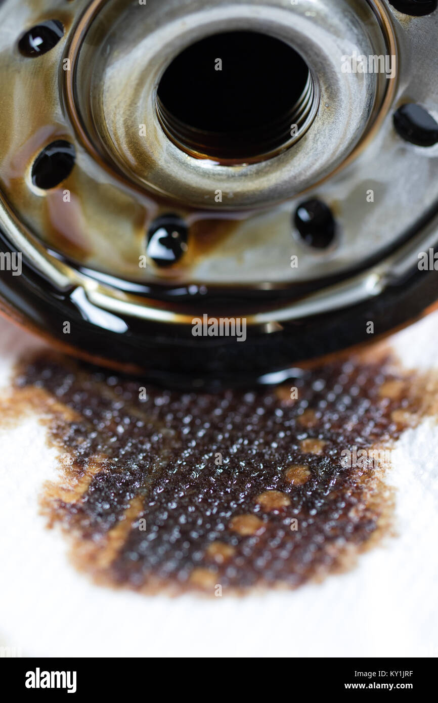used automotive oil filter with oil stains. Stock Photo