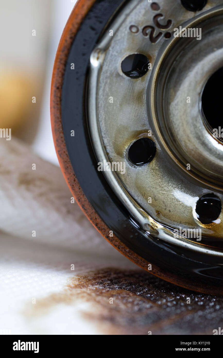 used automotive oil filter with oil stains. Stock Photo