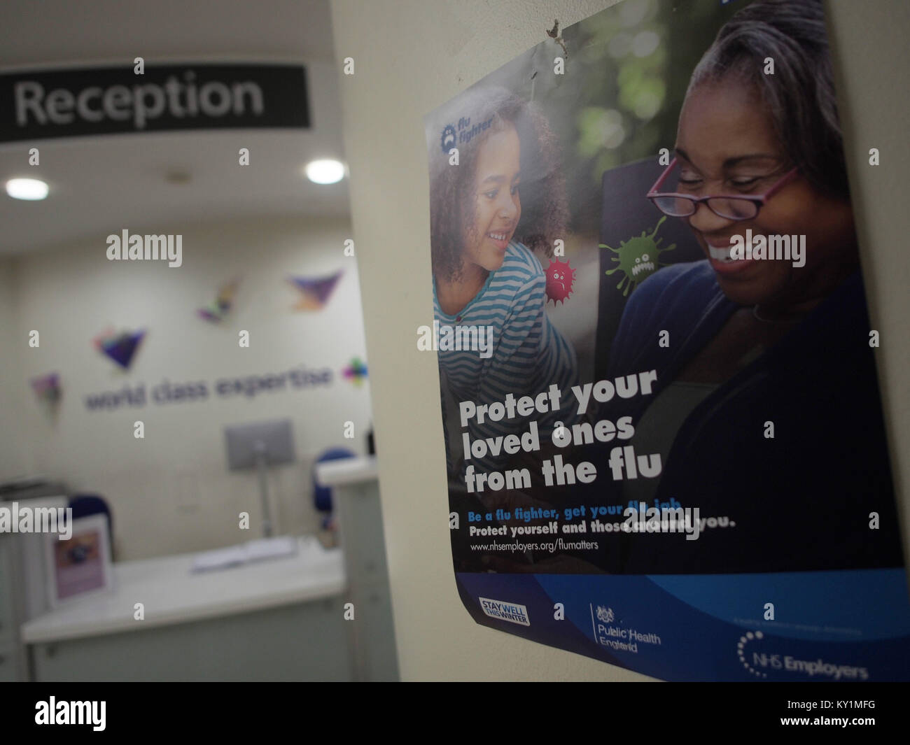 A flu information poster on the wall of a London hospital Stock Photo ...