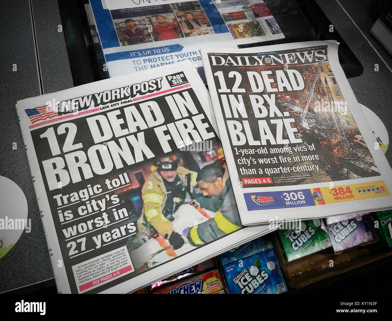 Headlines of the New York Daily News and the New York Post have identical headlines on Friday, December 29, 2017 editions reporting on the death of 12 in the worst fire the city has seen in 27 years. (© Richard B. Levine) Stock Photo