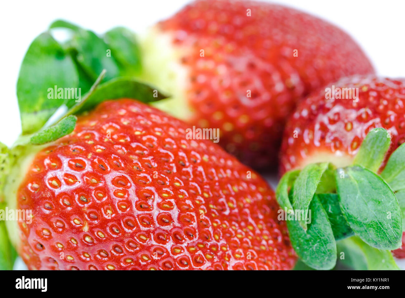 Ripe strawberry on white background Stock Photo - Alamy