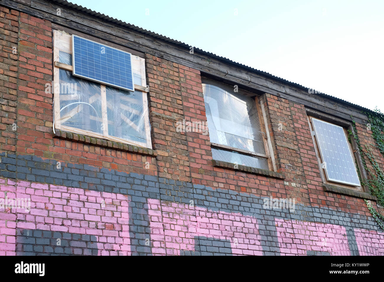 January 2018 - Solar panels fitted to a derelict building used by squatters and the homeless in Bristol Stock Photo