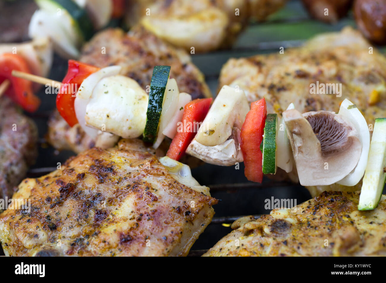 barbecue with delicious grilled meat and vegetables on grill Stock ...