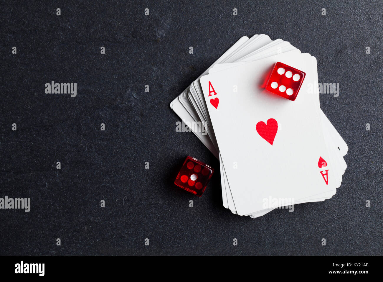 Ace playing cards with red dice. Casino betting and gambling concept Stock Photo