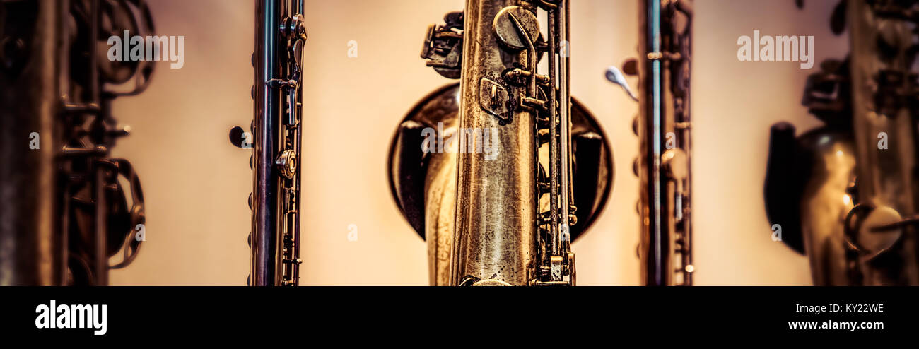 A collection of woodwind instruments including a flute and saxophones. Stock Photo