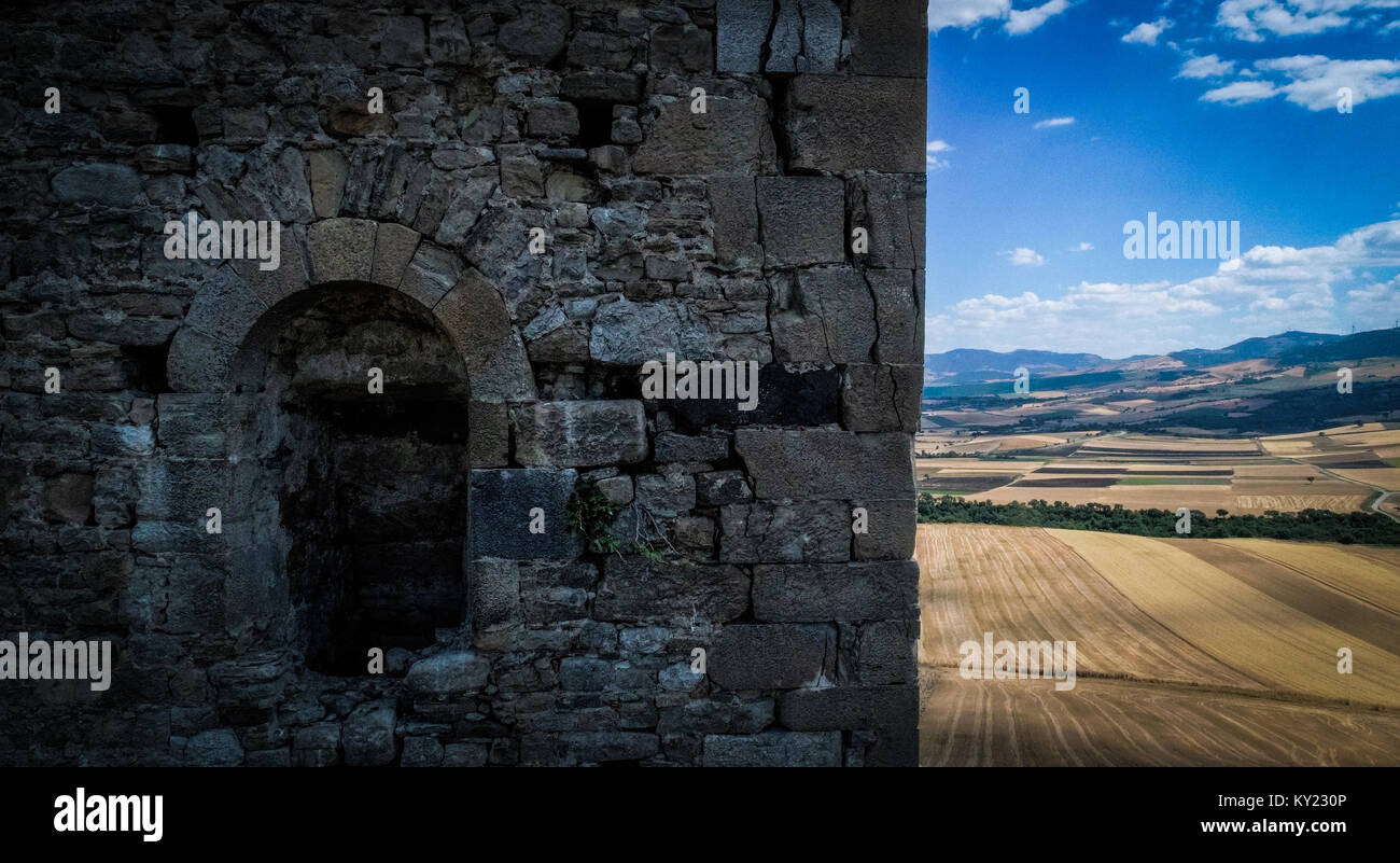 Window or ventilation system on the north facade of the medieval keep in Montecorvino, Volturino, Italy. Stock Photo