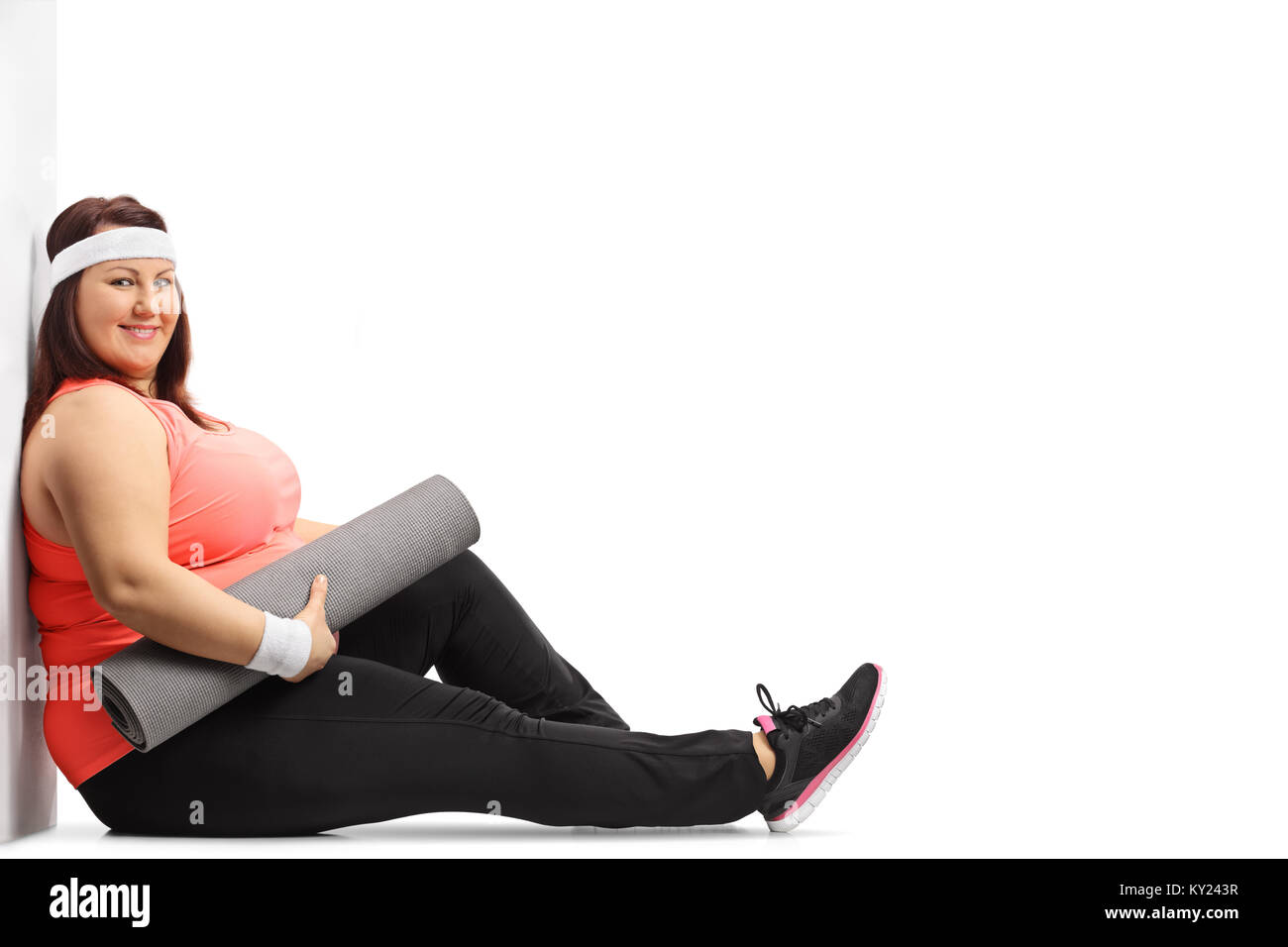 Cute African American Woman Plus Size Sitting on Fitness Mat Stock