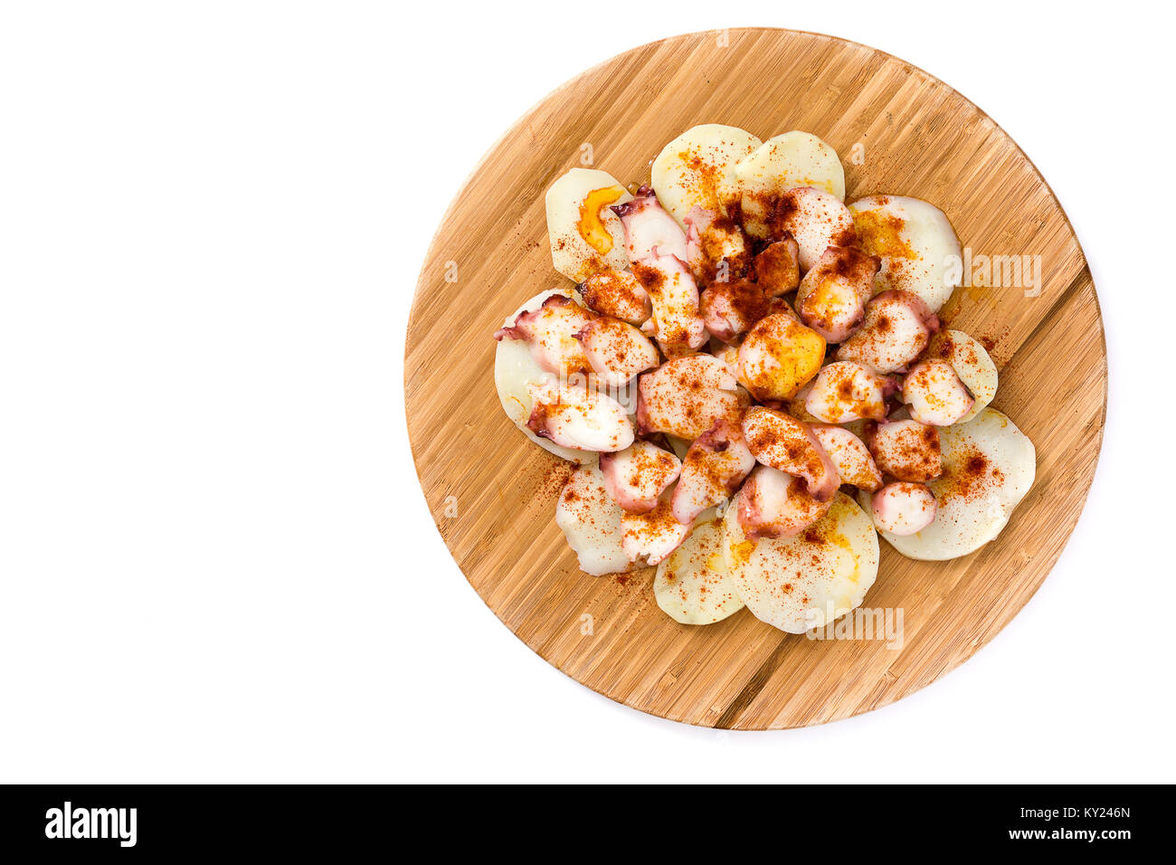 Pulpo a la gallega. Galician octopus on wood. Typical spanish food isolated on white background Stock Photo