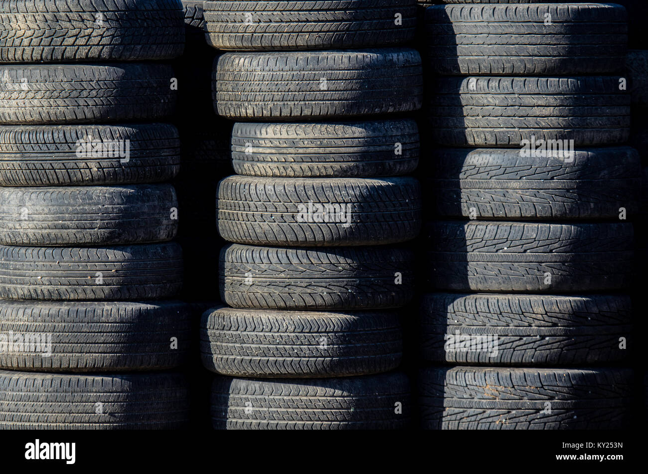 worn auto tires stacked at recycling facility Stock Photo Alamy