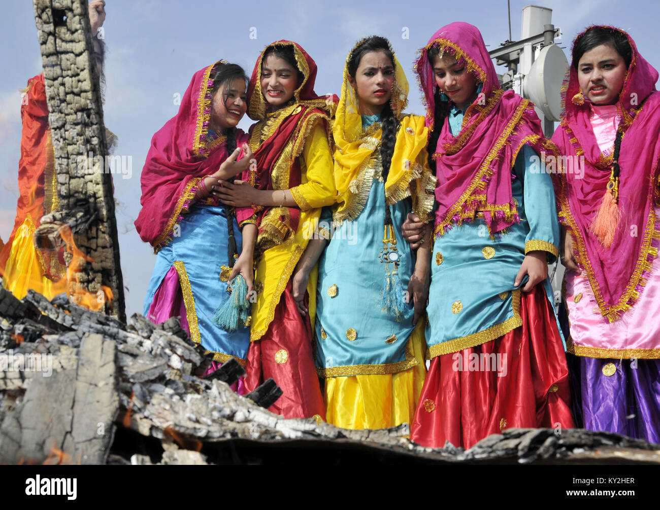 Amritsar. 12th Jan, 2018. School girls wearing traditional Punjabi attire  celebrate on the eve of Lohri festival in Amritsar, India, Jan. 12, 2018.  On Lohri day people fly kites in the day