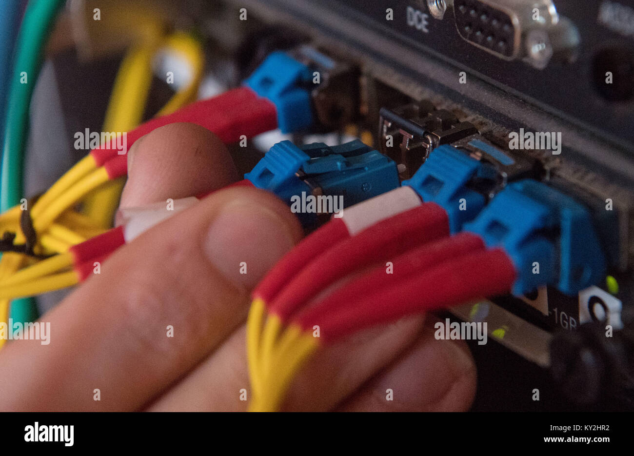 A specialist for the installation of optical fibre demonstrates how a ...