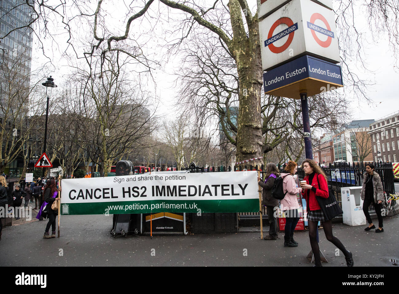 London, UK. 12th January, 2018. Local residents and environmental campaigners protest against the planned felling of mature London Plane, Red Oak, Common Lime, Common Whitebeam and Wild Service trees in Euston Square Gardens to make way for temporary sites for construction vehicles and a displaced taxi rank as part of preparations for the HS2 rail line. Stock Photo