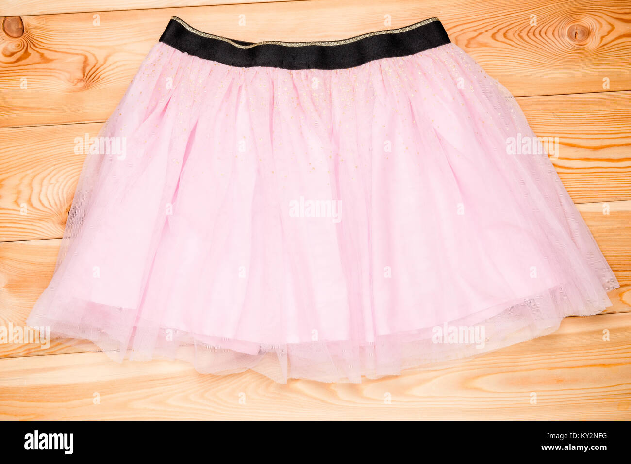 pink tulle skirt on wooden boards for girls Stock Photo