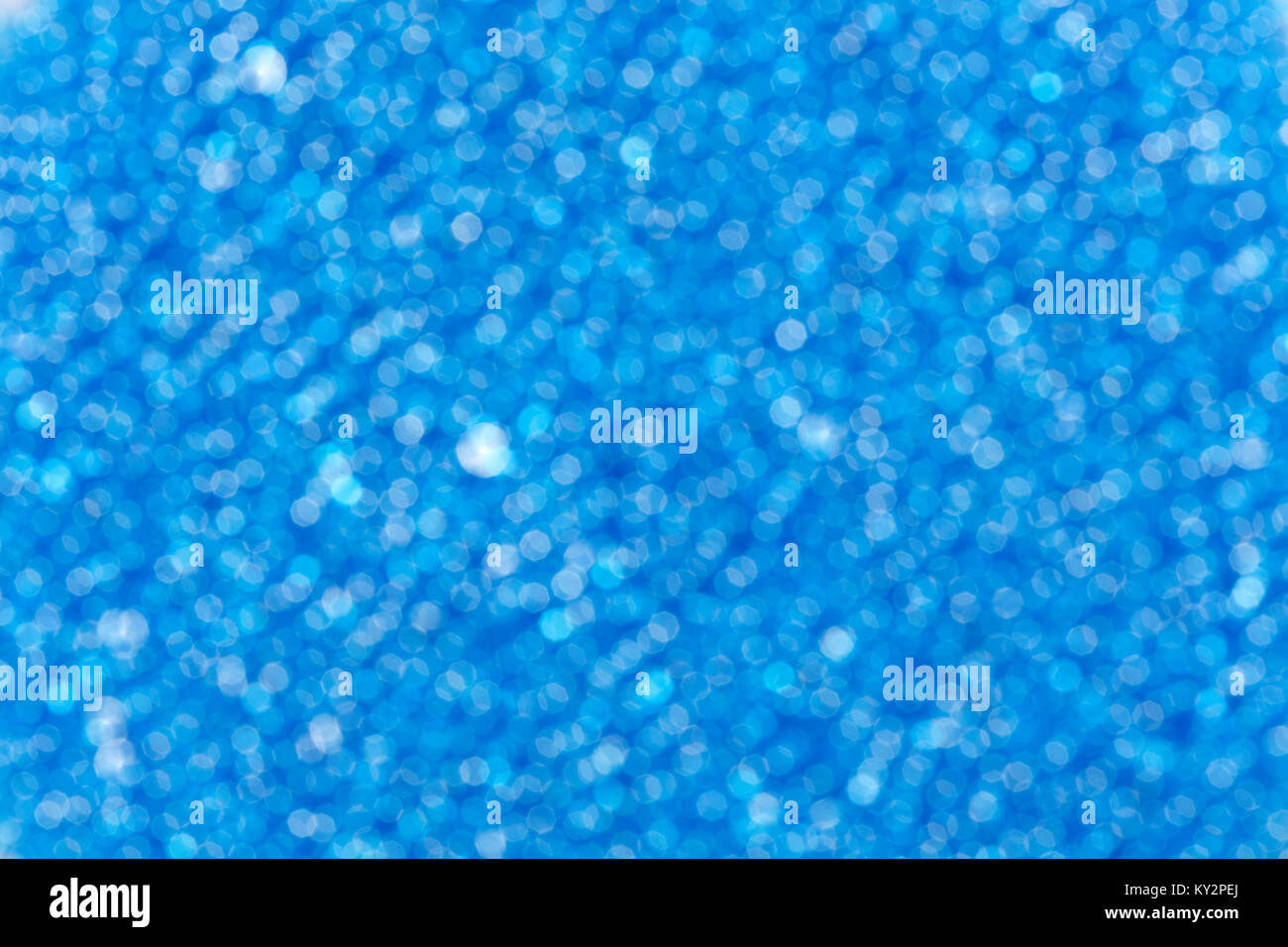 Blue blurred christmas background with snowflakes hi-res stock ...
