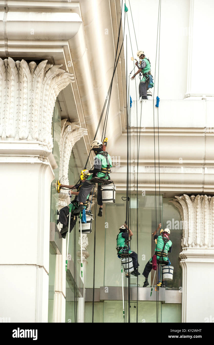 BANGKOK, THAILANDNOVEMBER 18,2016 Group of unidentified Glass cleaner