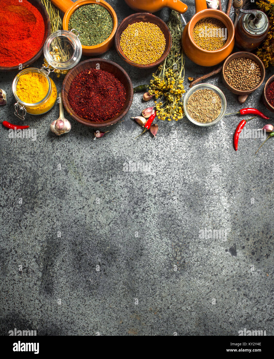 Various spicy spices and herbs. On a rustic background Stock Photo - Alamy