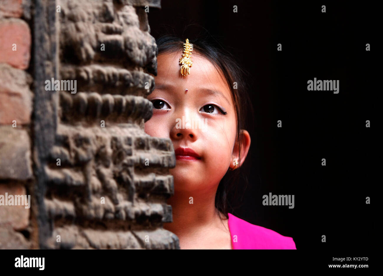 A young Newar girl participating in Hindu ritual in Kathmandu. Stock Photo