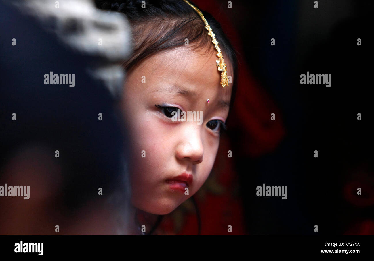 A Newar girl participating in Hindu ritual in Kathmandu. Stock Photo