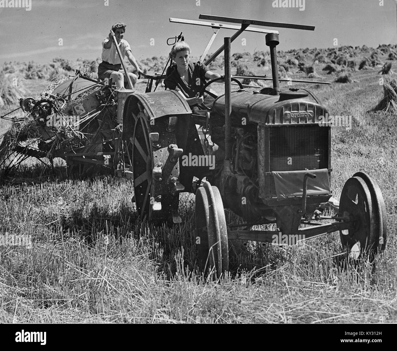 Fordson Tractor with Land Girls in 1940's Stock Photo