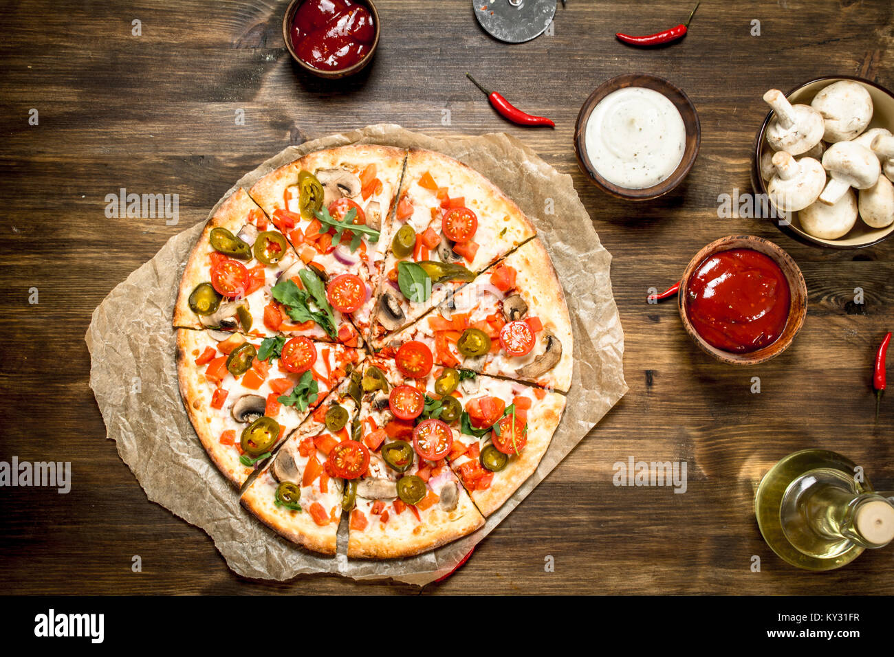 Hot Mexican pizza. On a wooden table Stock Photo Alamy
