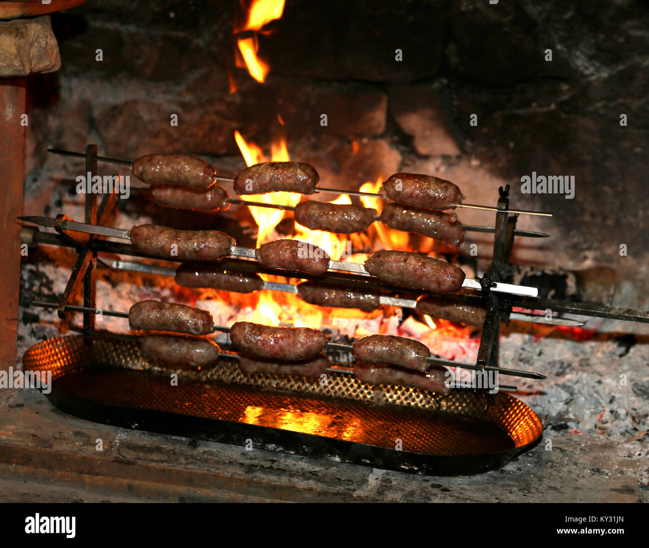 cooking many sausage with very hot fire during village festival Stock ...