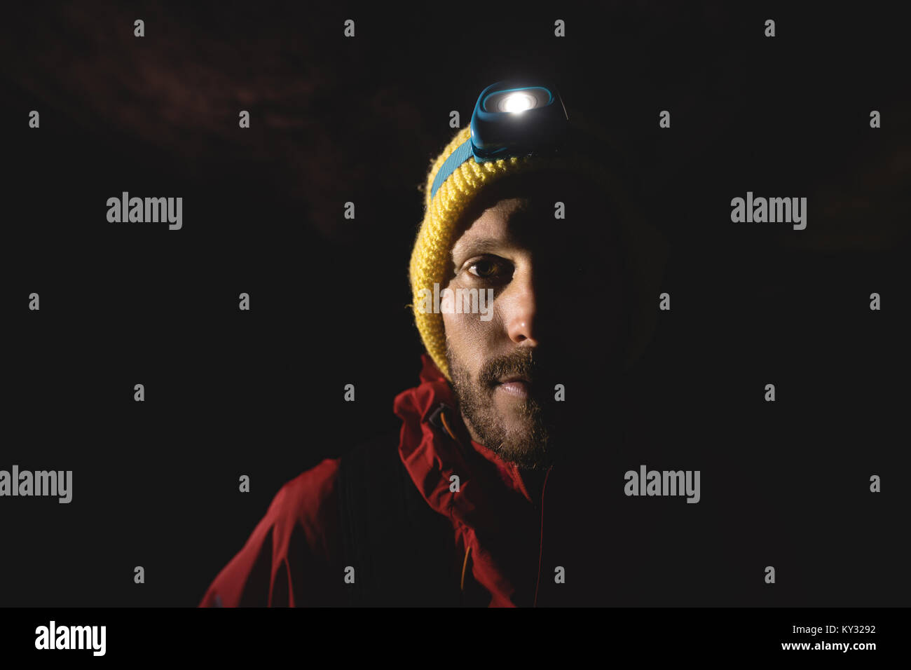 Hiker wearing head torch Stock Photo