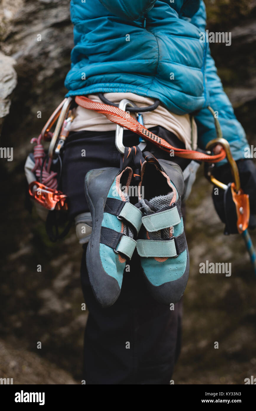 rock climbing shoes and harness