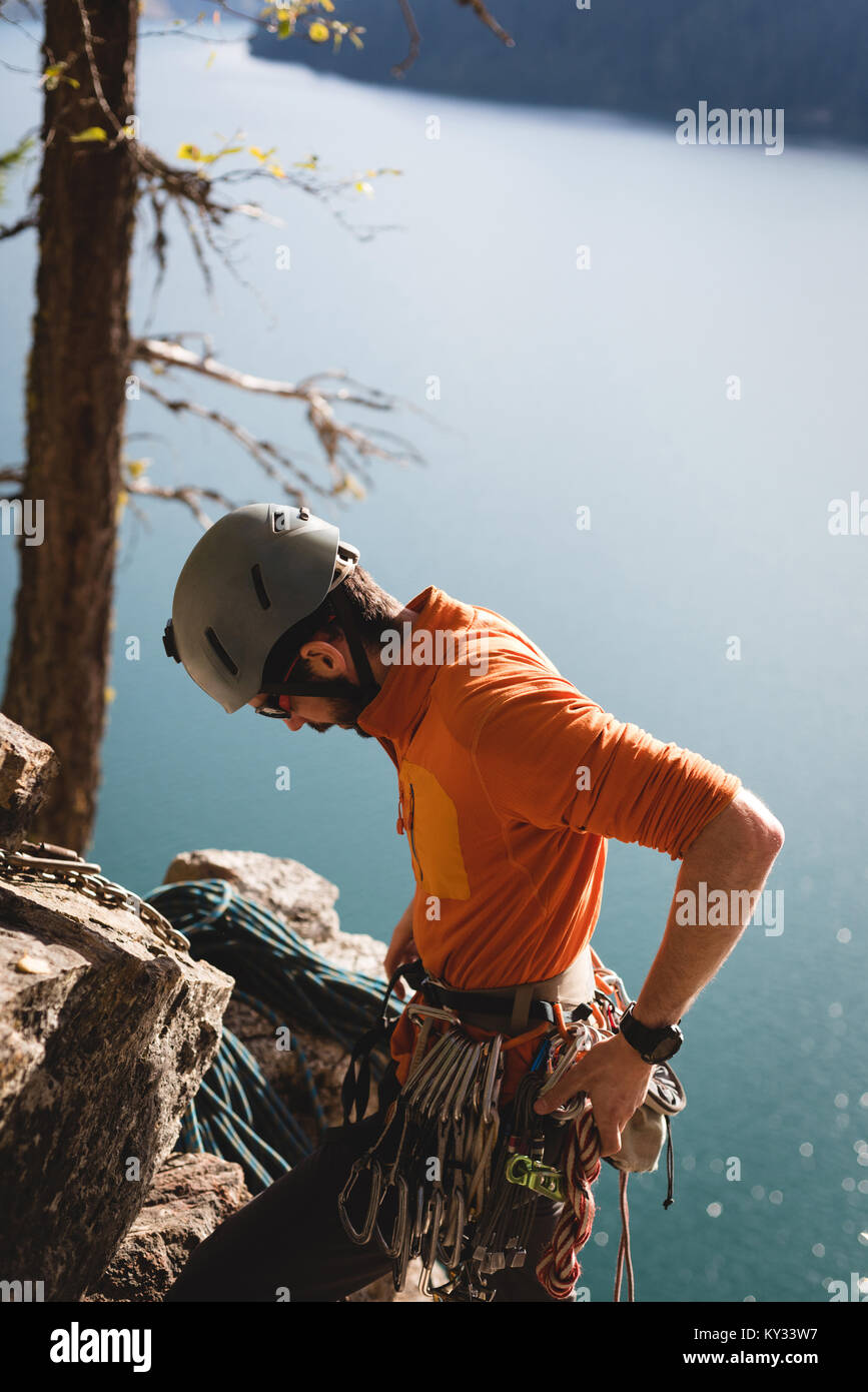Hiker adjusting the carabiner with rope Stock Photo - Alamy